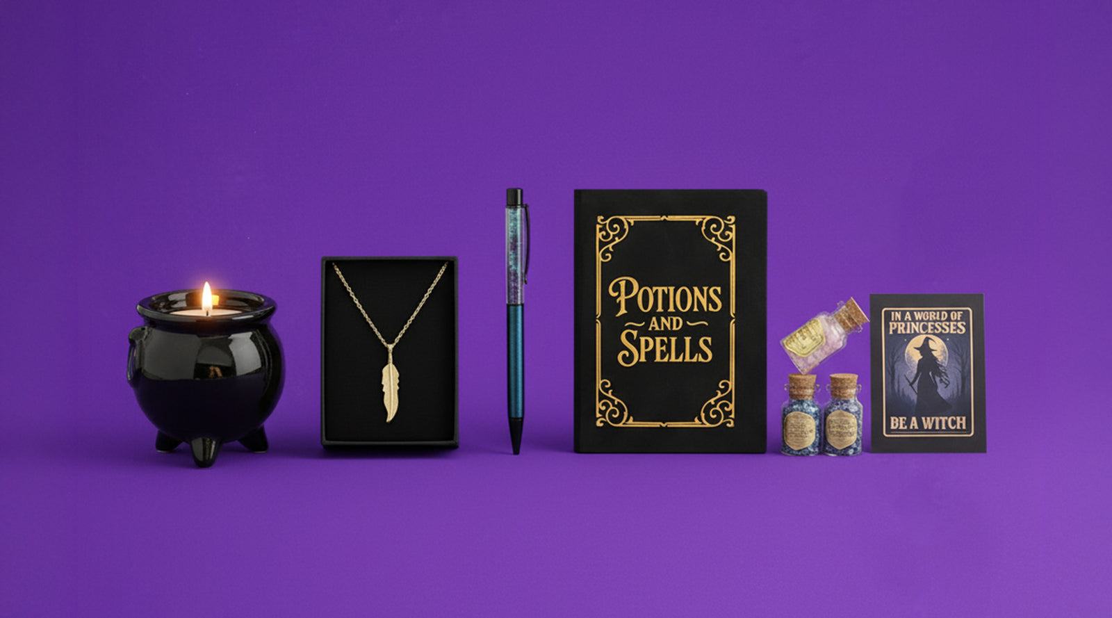 Collection of witch-themed items including a cauldron, necklace, pen, notebook, and bottles on a purple background