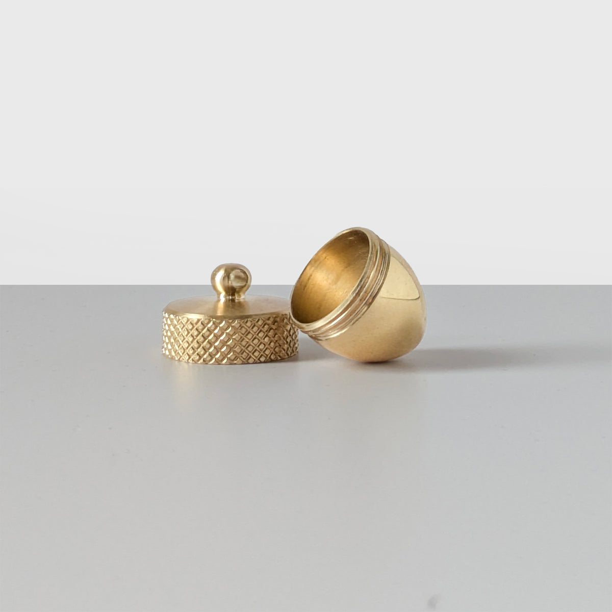 Brass acorn locket with a twist-off top