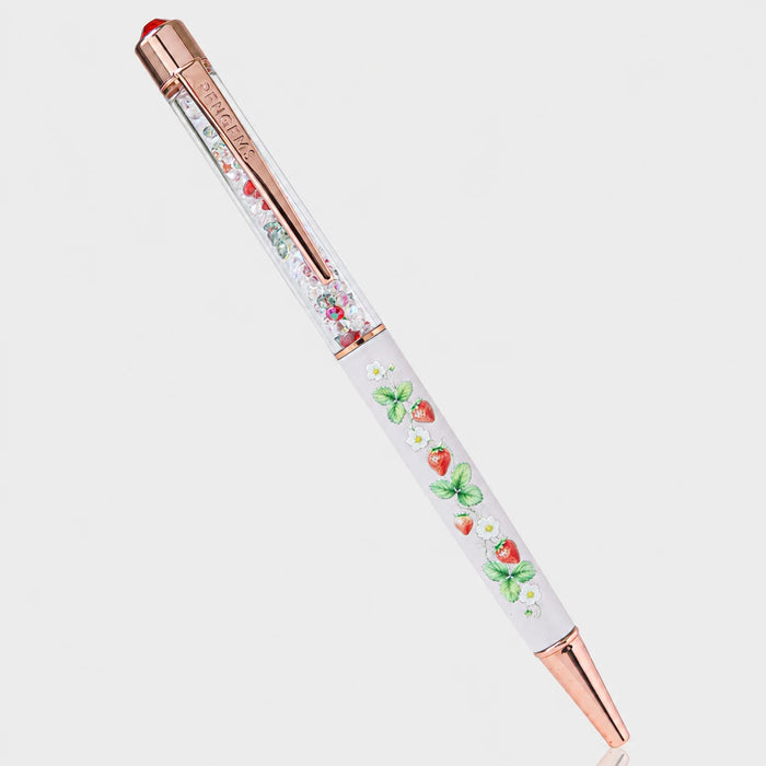 Strawberry Faire crystal pen with a light pink barrel printed with strawberries, white blossoms, and green leaves, rose gold hardware, and a clear crystal-filled chamber with red accents.